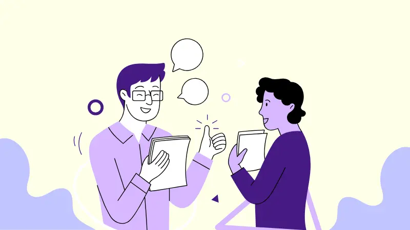 Two coworkers talking, thumbs up — alternative careers for teachers