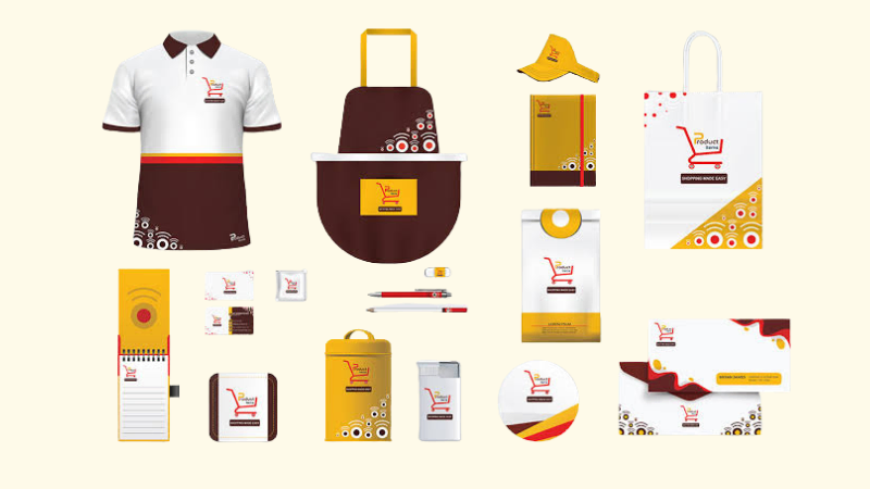 A branding kit mockup showing a logo applied to a shirt, apron, bags, and stationery, representing branding kits as a digital product